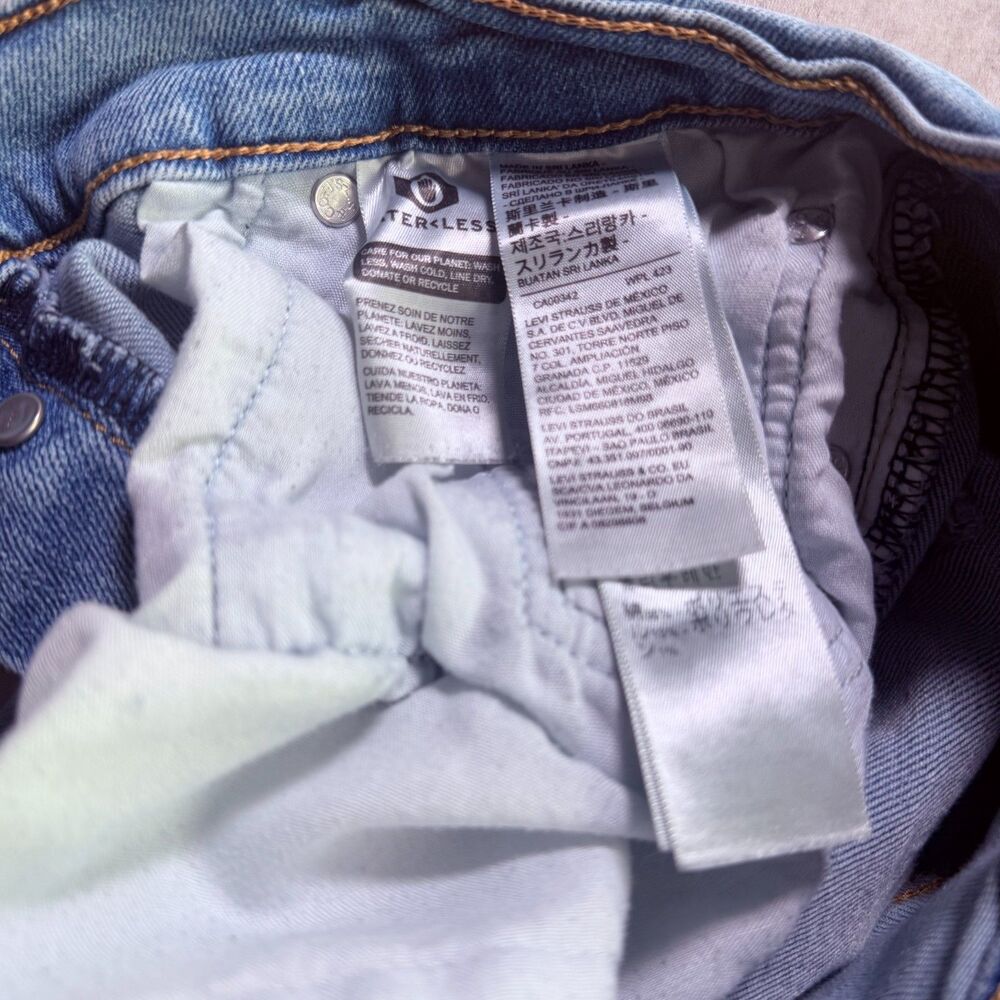 Levi’s Ribcage Straight Ankle Light Wash Raw Hem Jeans 28